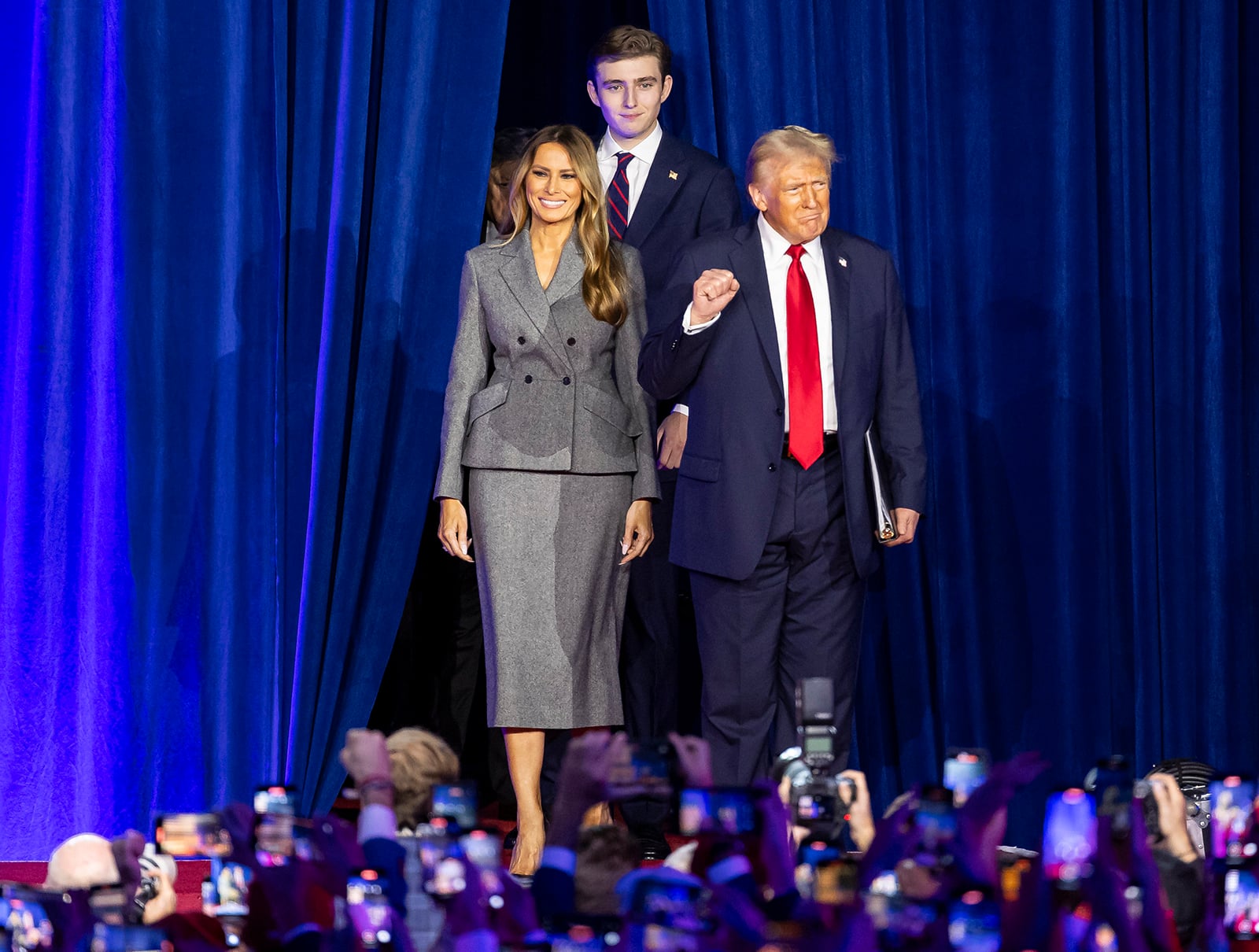 President Donald Trump arrives to his election night party alongside his wife, Melania Trump, and his son, Barron Trump
