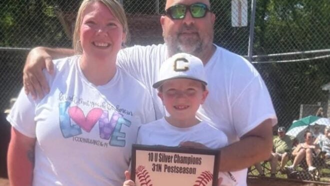 Stephen Morrow poses with his family during sons baseball achievement. P