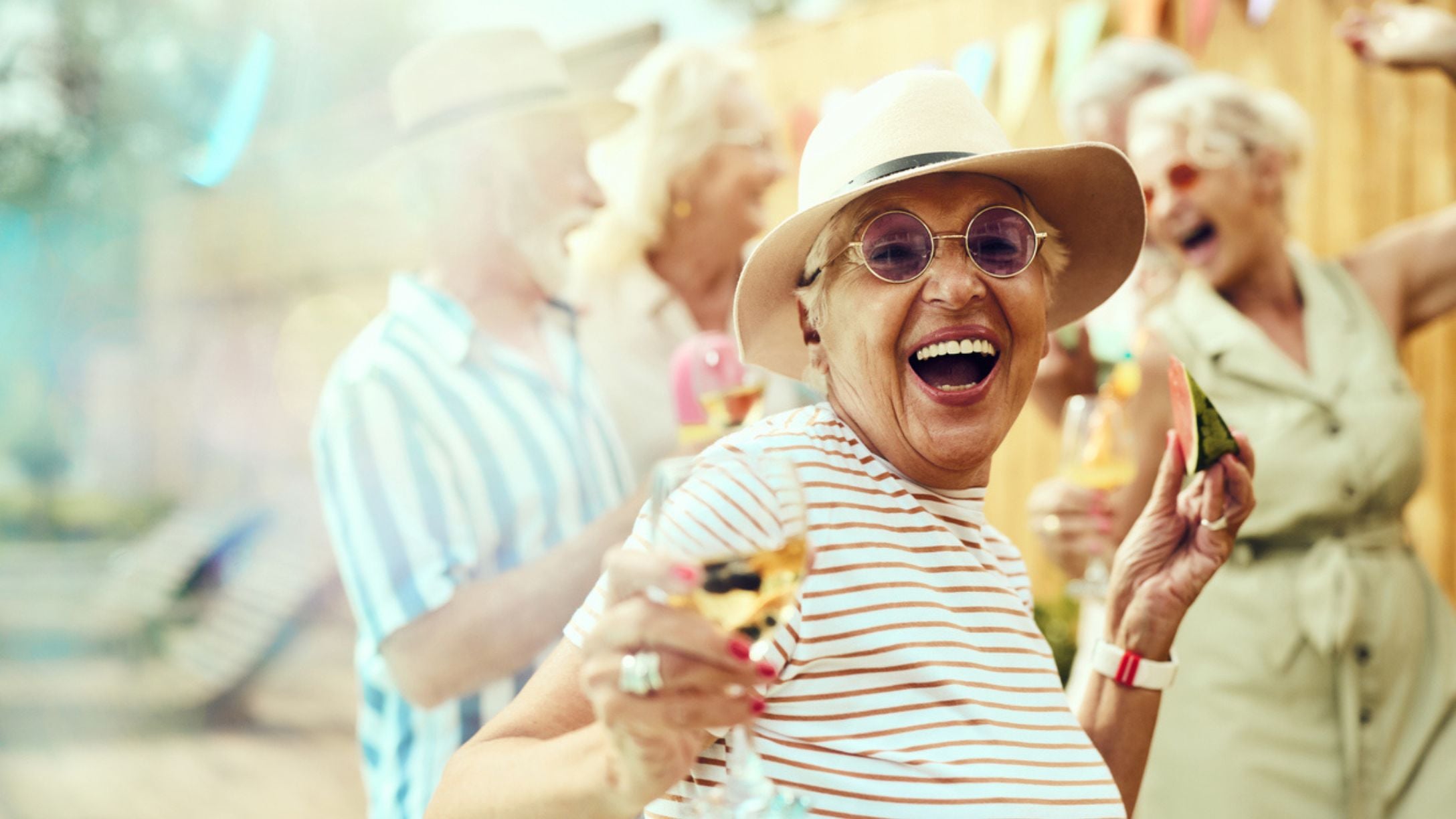 Several senior women enjoying a party together outdoors