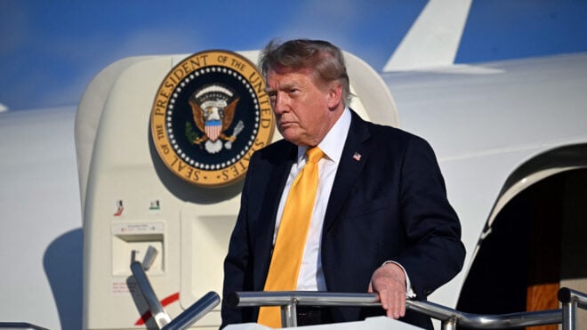 US President Donald Trump steps off Air Force One
