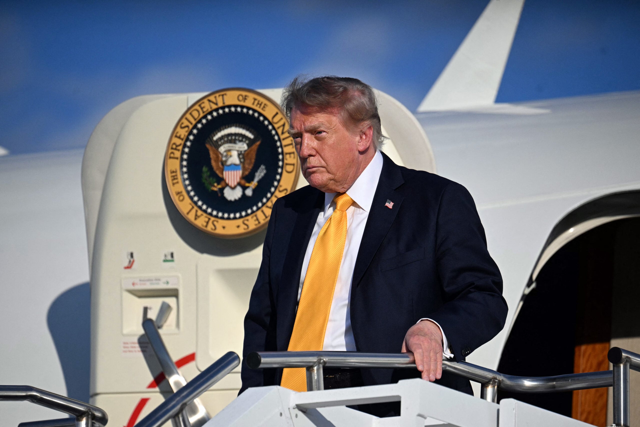 US President Donald Trump steps off Air Force One