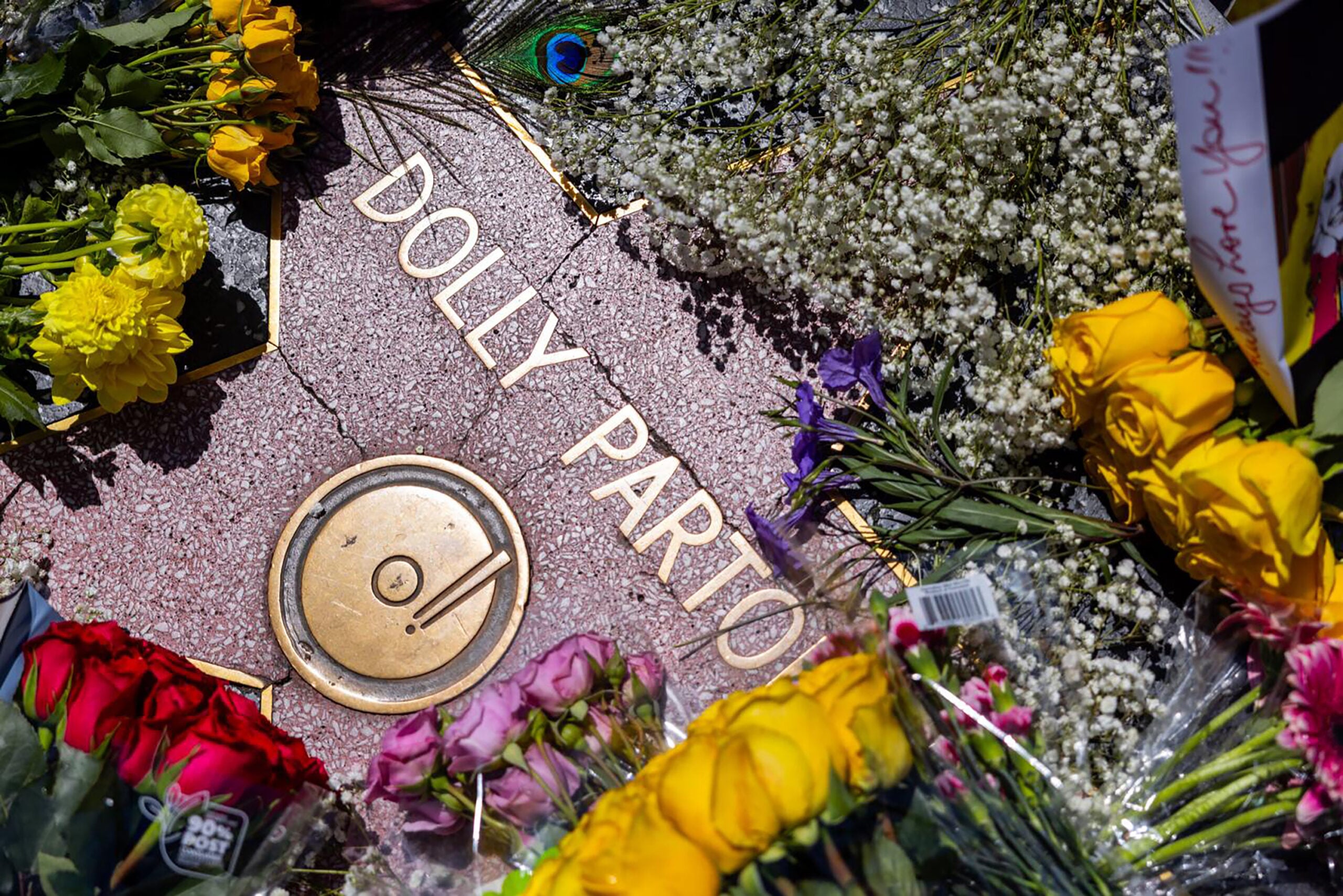 Flowers are placed in mourning at Dolly Parton's star