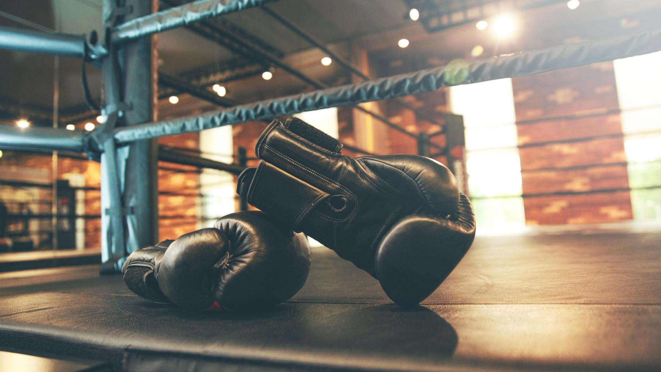 Boxing gloves on floor of ring