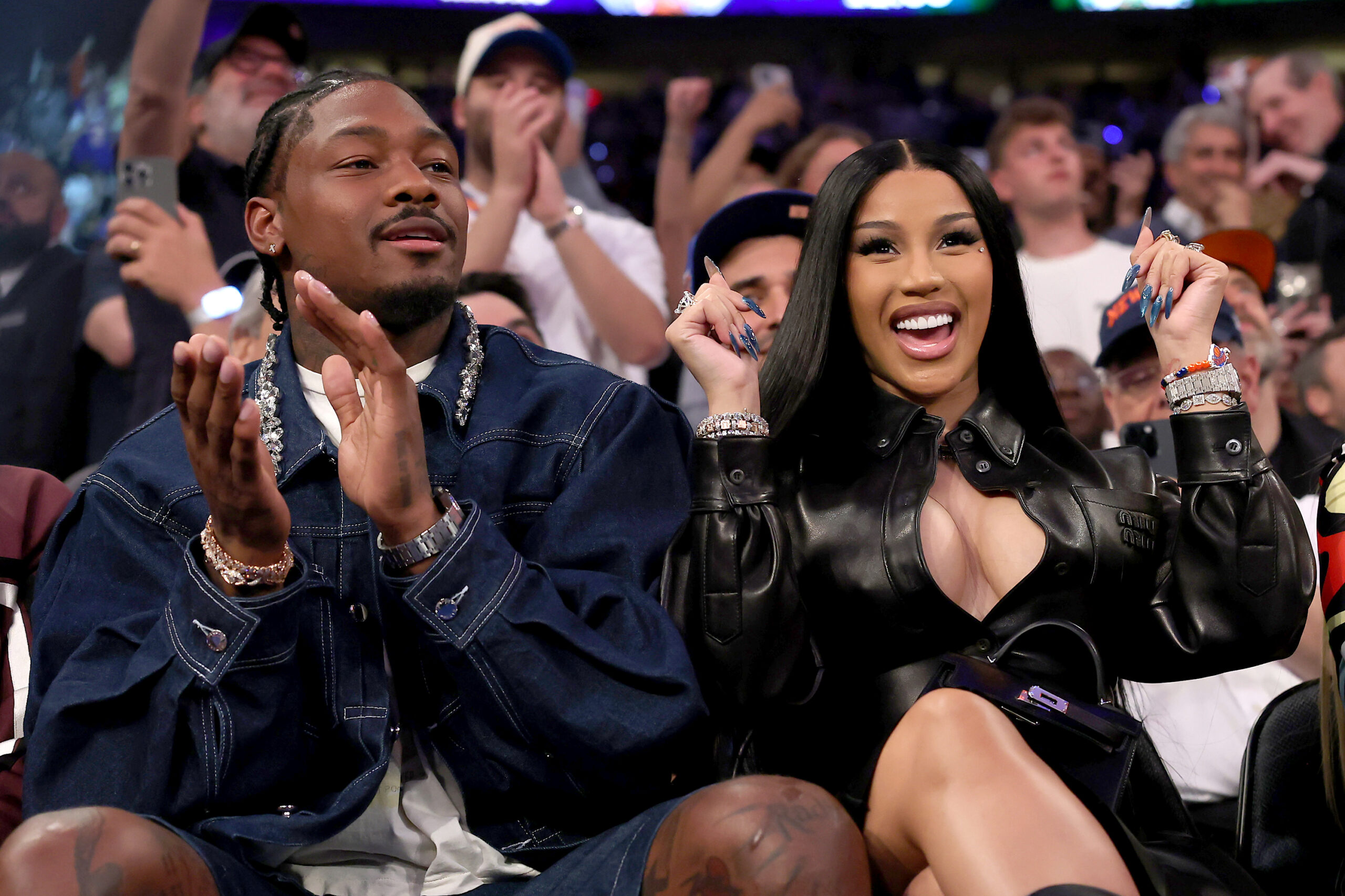 (L-R) NFL Player Stefon Diggs and rapper Cardi B sits court-side during the first quarter in Game Four of the Eastern Conference Second Round NBA Playoffs between the Boston Celtics and the New York Knicks at Madison Square Garden on May 12, 2025 in New York City.