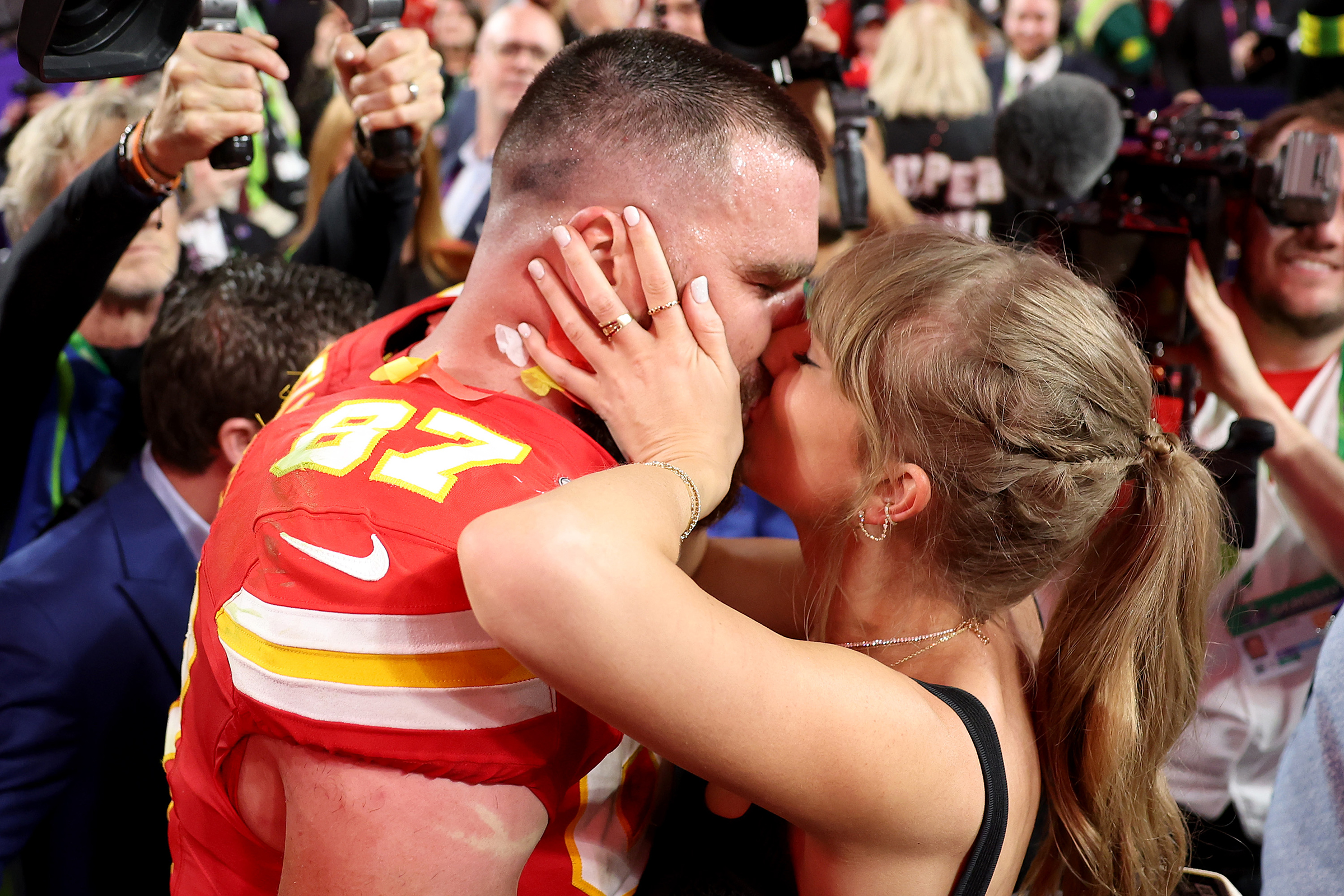 Travis Kelce of the Kansas City Chiefs kisses Taylor Swift after defeating the San Francisco 49ers, 25-22, in overtime during Super Bowl LVIII at Allegiant Stadium on Feb. 11, 2024, in Las Vegas.