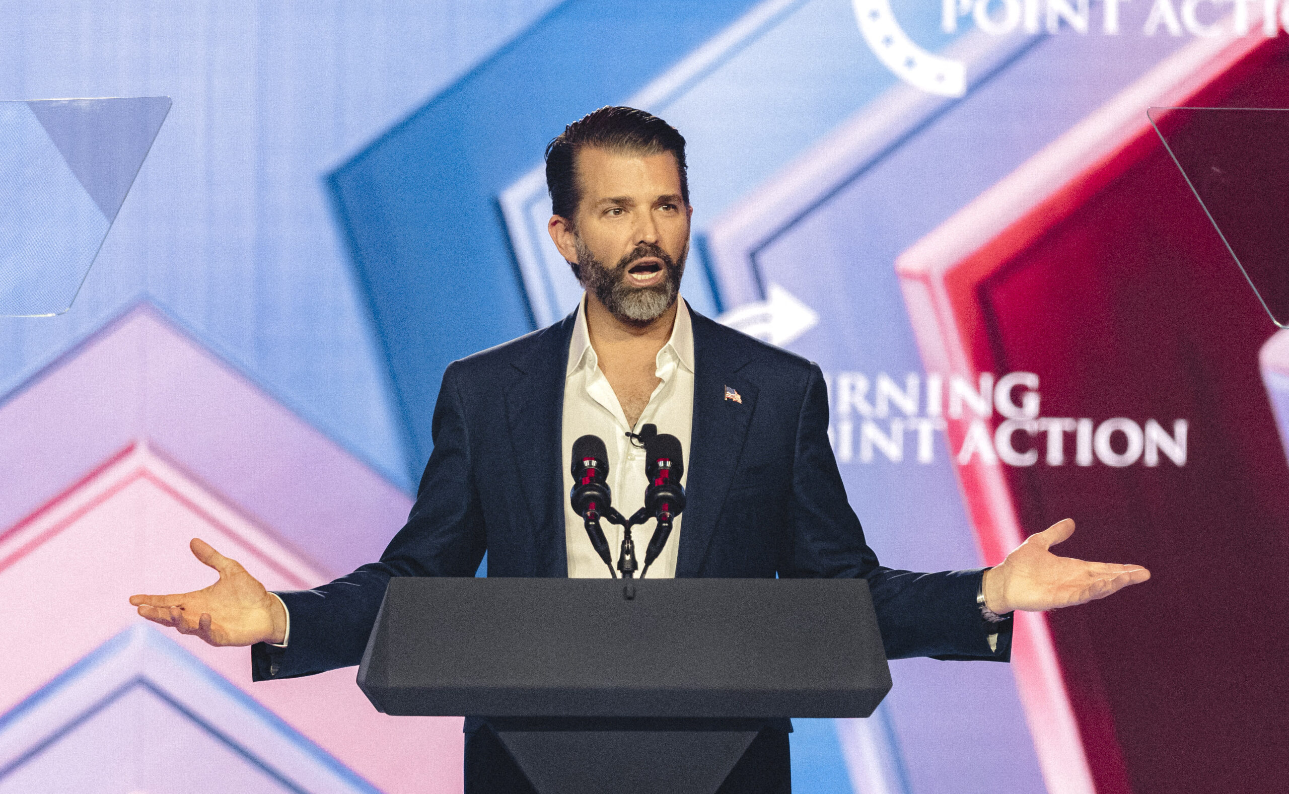 Donald Trump Jr. speaks on stage during Turning Point's annual AmericaFest conference