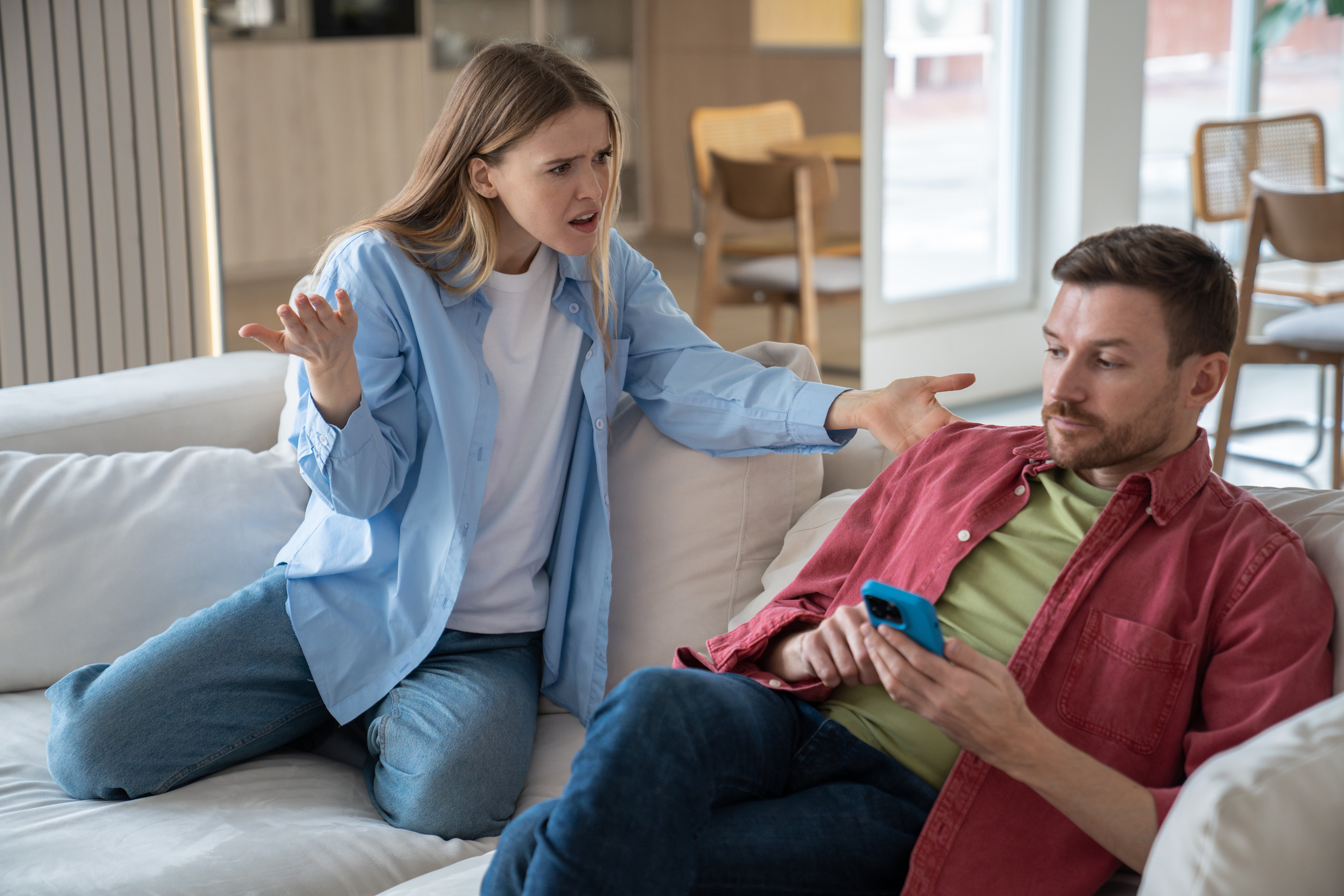Angry irritated woman shouting at husband