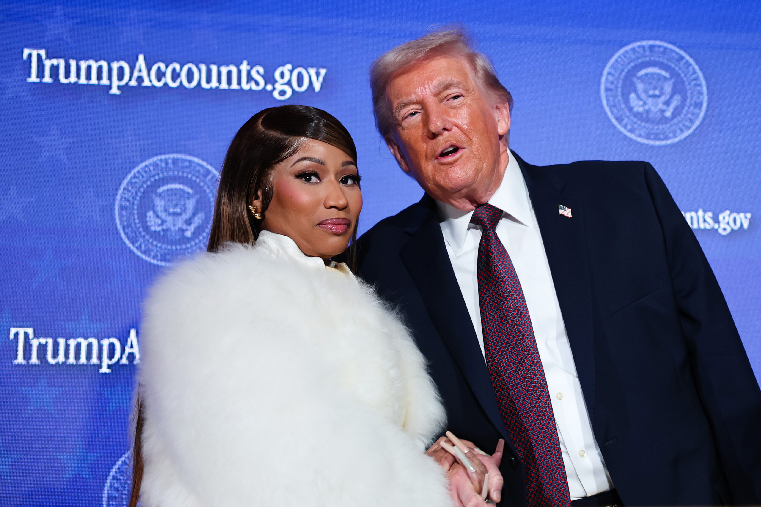 Musician Nicki Minaj, left, joins U.S. President Donald Trump on stage