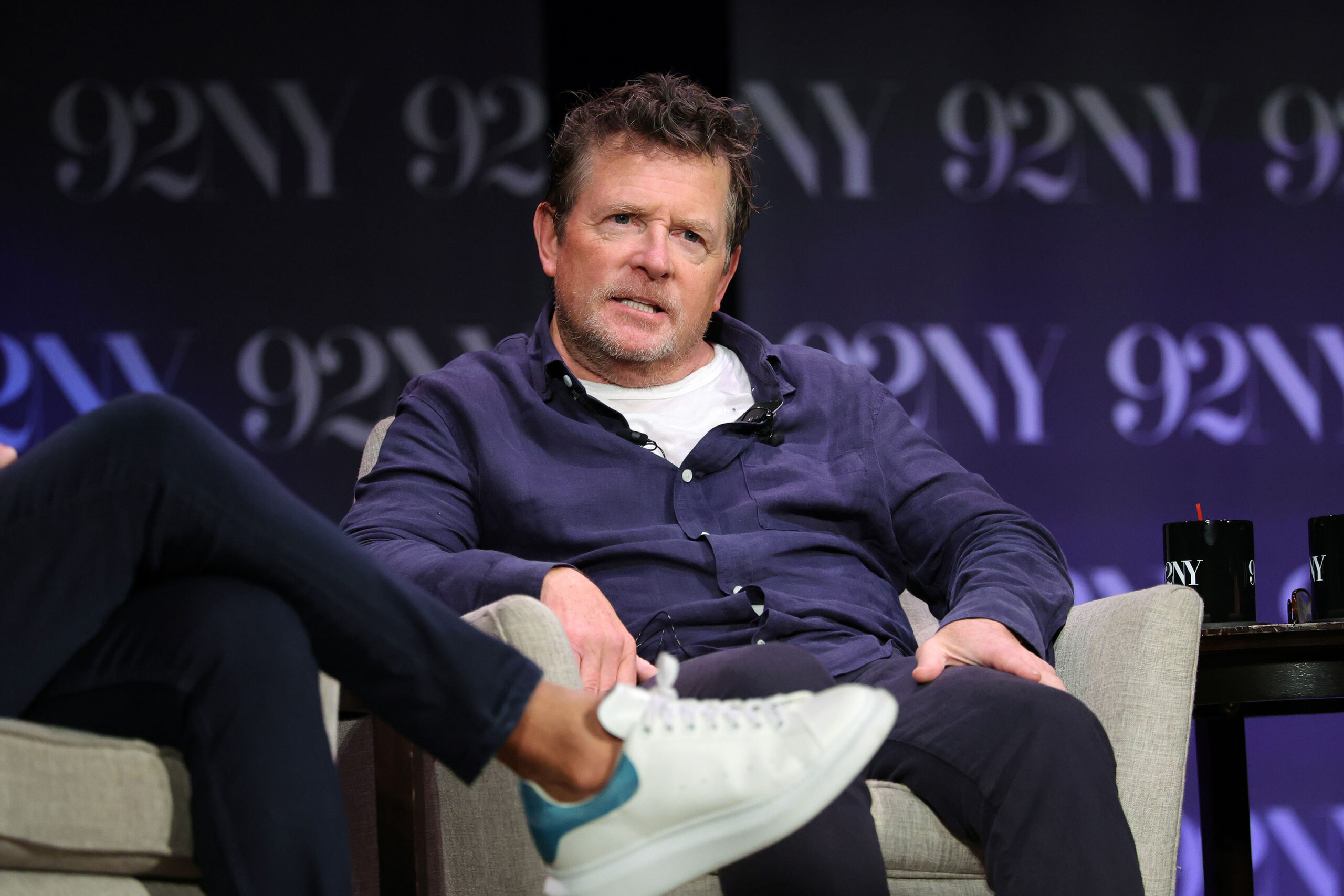 Michael J. Fox speaks onstage